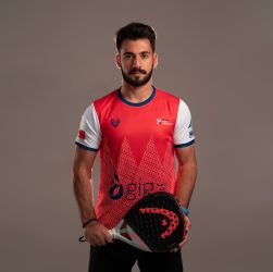 Man in Red and White Shirt Holding Red and Black Padel