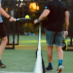 a person hitting a ball with a racket