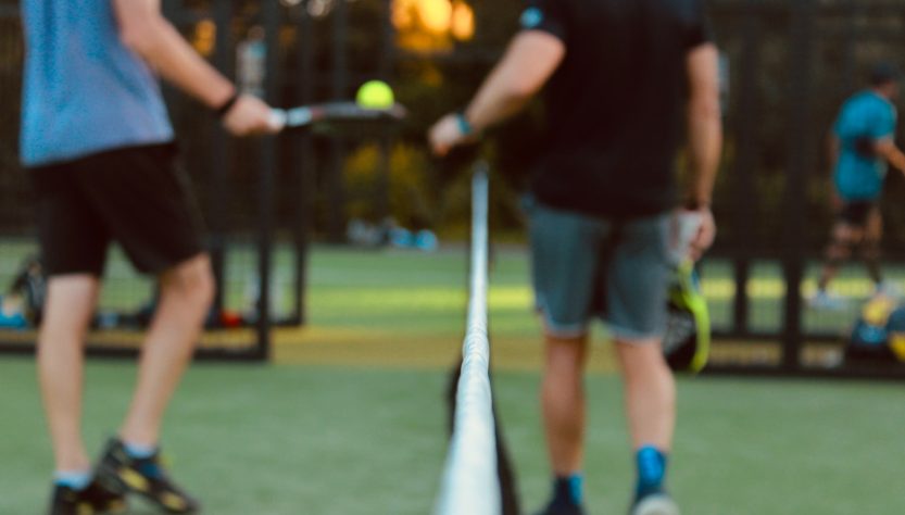 a person hitting a ball with a racket